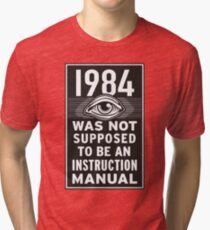 1984 Instruction Manual Tri-blend T-Shirt