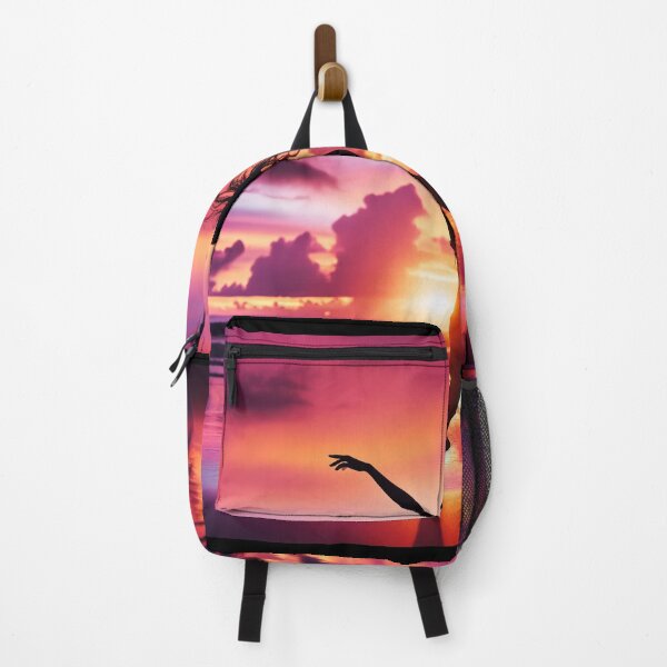 Item preview, Woman dancing freely on a beach at sunset, her form outlined against the vibrant colors of the sky designed and sold by AndreaMart.