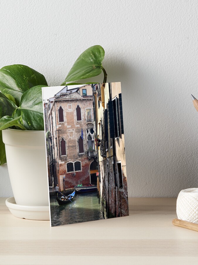 Thumbnail 1 of 2, Art Board Print, Gondolier in the secret canals of Venice, Italy designed and sold by KarenEspig.
