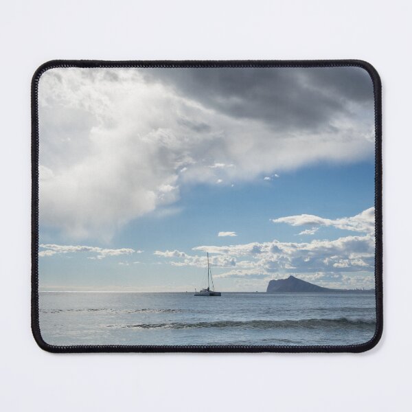 Item preview, Soft clouds float over the Mediterranean Sea, seascape with sailing boat designed and sold by Adriana Mueller.
