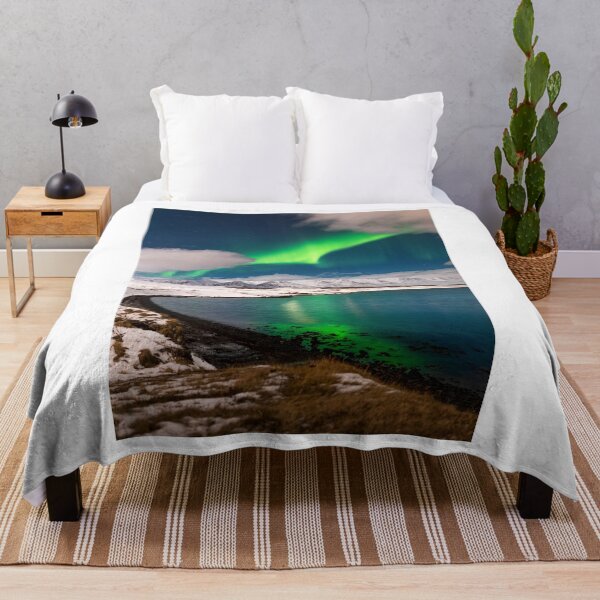 Item preview, Northern light in Iceland over Eyjafjordur fjord designed and sold by rogerstanger.