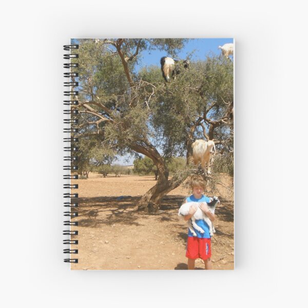 Goats up a tree with boy Spiral Notebook