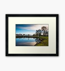 Scenic views over the still waters of the Causeway at Godmanchester Framed Print