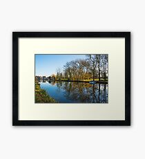 Scenic views over the still waters of the Causeway at Godmanchester Framed Print