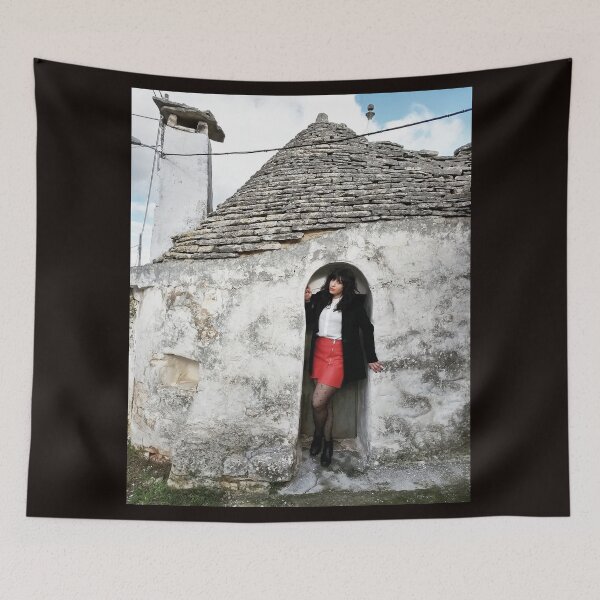 Item preview, Timeless Charm: Girl Posing in Front of a Trullo designed and sold by EpicVistas.