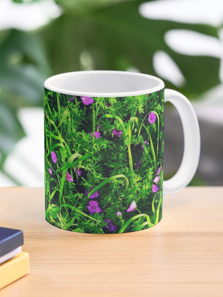 Thumbnail 1 of 6, Coffee Mug, Green Grass Summer Background with Little Lilac Flowers designed and sold by Mallorn.