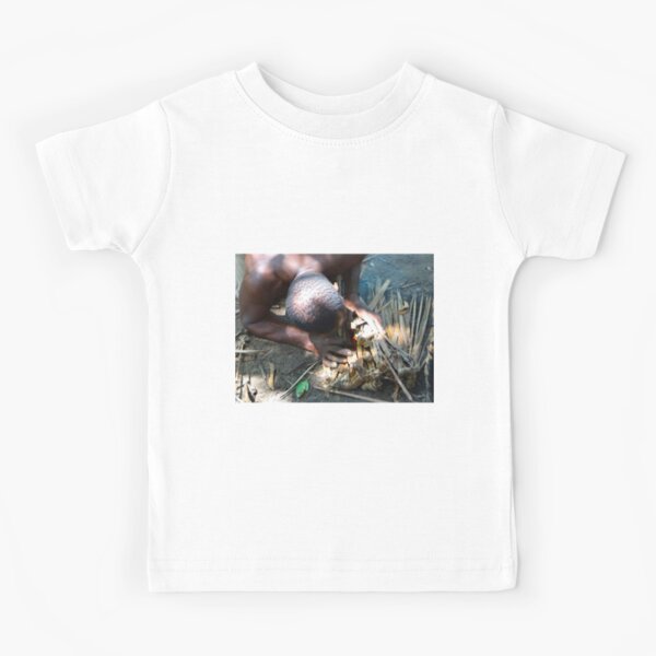Lamu Island man breathe life into a fire Kids T-Shirt
