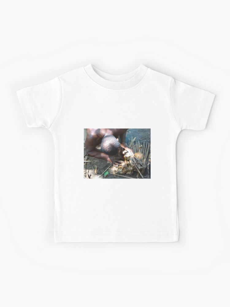 Lamu Island man breathe life into a fire Kids T-Shirt