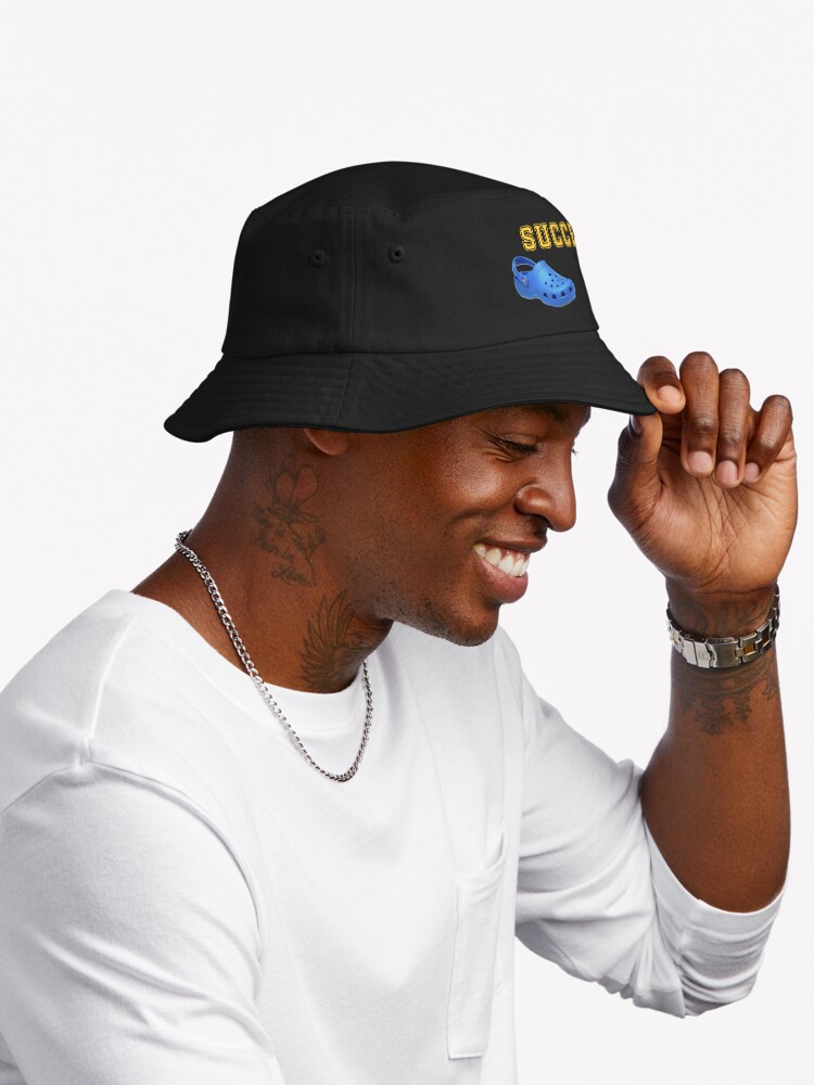 Thumbnail 2 of 6, Bucket Hat, Stride to Success: Crocked Achievement Design designed and sold by rohanharry.