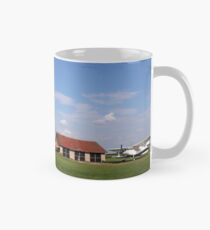 old crop duster airplanes on land airfield Mug