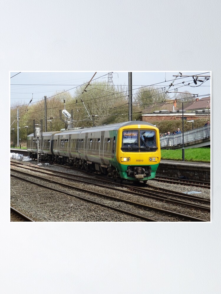 Alternate view of West Midlands Railway 323212 at Longbridge Poster