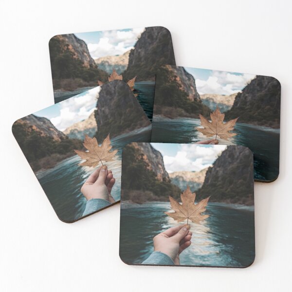 Item preview, Hand holding a leaf in front of a river designed and sold by AIEverything.