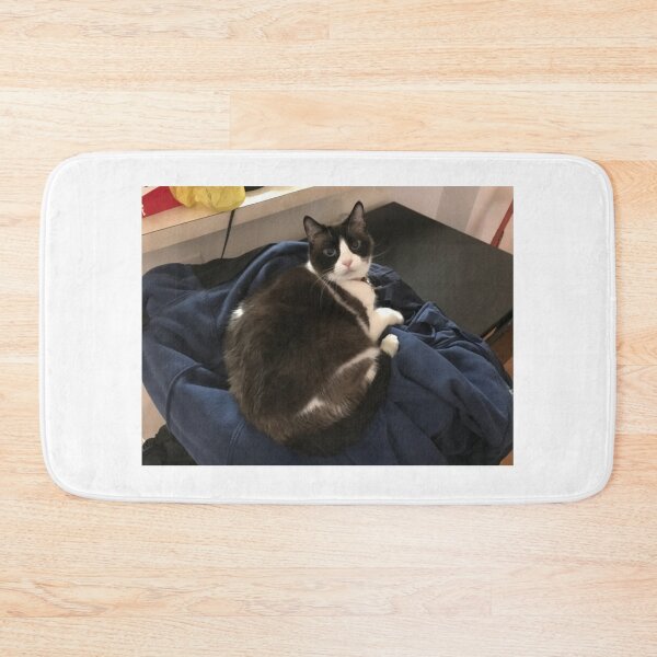 Item preview, Adorable cat laying on clothes designed and sold by OutOfTordinary.