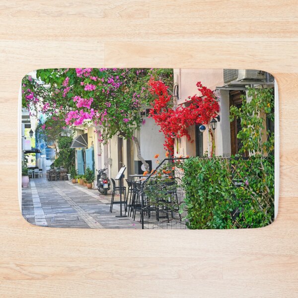 Item preview, Old houses in the narrow streets of Nafplion town with Bougainvillea flowers designed and sold by goceris.