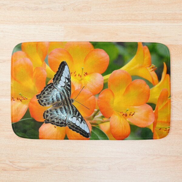 Item preview, A blue butterfly pollinating Rhododendron simbu sunset flowers designed and sold by Peter Etchells.