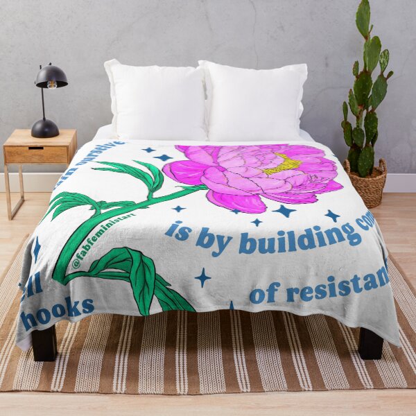 Item preview, "One of the most vital ways we sustain ourselves is by building communities of resistance, places where we know we are not alone." bell hooks designed and sold by fabfeminist.