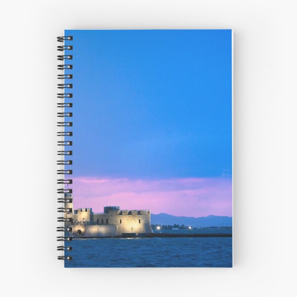Item preview, Sunset sky over Bourtzi water fortress in Nafplio, Peloponnese, Greece designed and sold by goceris.