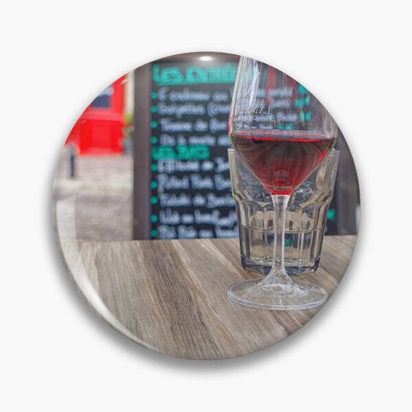 Item preview, Two glasses of red wine and a bottle on a table with  a blurred menu in France designed and sold by Photopat.