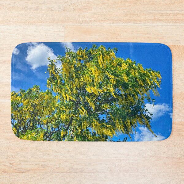 Item preview, Laburnum tree against a blue sky designed and sold by Violaman.