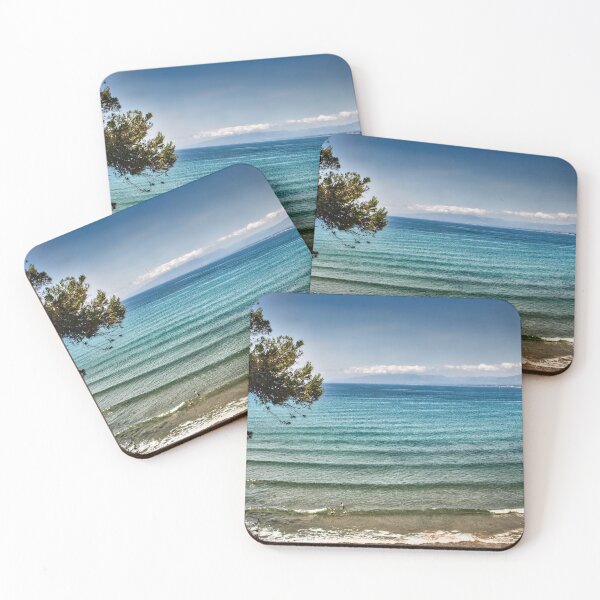 Item preview, Mediterranean bay with two people bathing on the shore designed and sold by seasandlands.