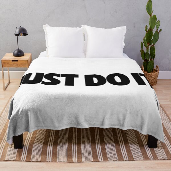 The surfwear trend originating <<Stussy>> Throw Blanket