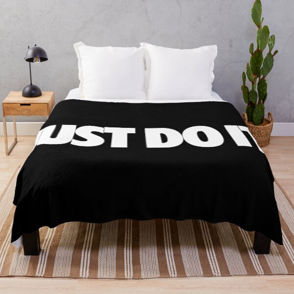 The surfwear trend originating <<Stussy>> Throw Blanket