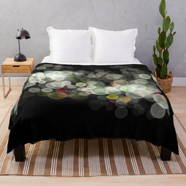 Item preview, Shimmering bokeh light glows on black background designed and sold by navitalidesign.