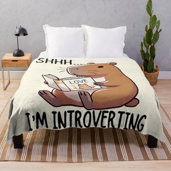 Item preview, Funny cute Capybara Reading - Shhh I'm Introverting - Introvert Humor. Gift for capybara lovers, book lovers and introverts designed and sold by Unitepeople.