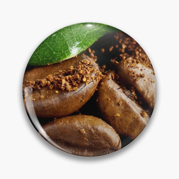 Item preview, Extreme close-up image of coffee beans and ground coffee with green leaf. designed and sold by Vetagio.