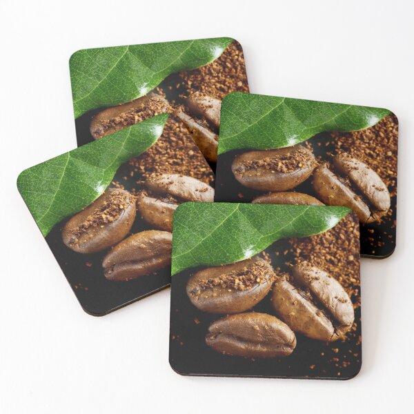 Item preview, Extreme close-up image of coffee beans and ground coffee with green leaf. designed and sold by Vetagio.