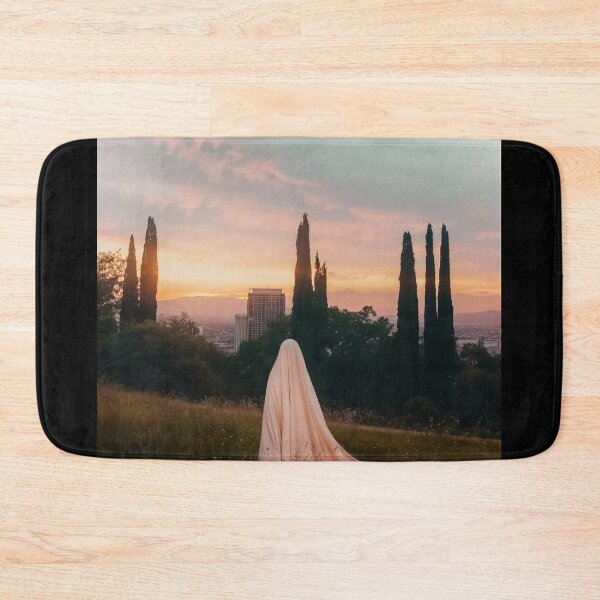 Item preview, Veiled Woman On A Meadow With A City In The Background At Sunset - Photography designed and sold by regnumsaturni.