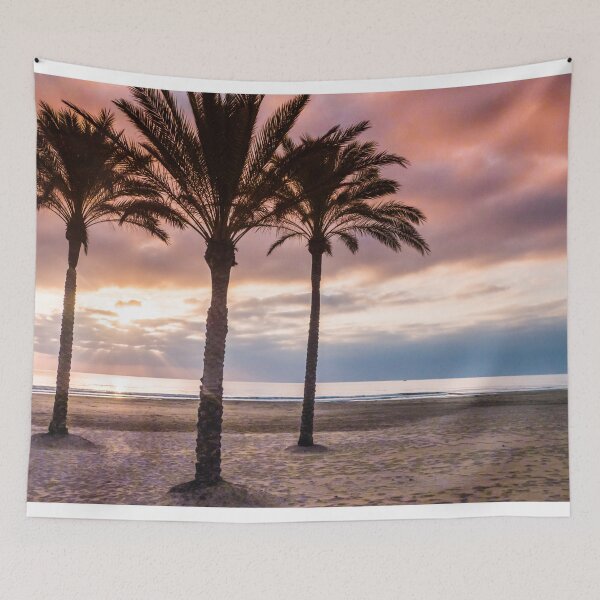 Item preview, The Sun Rising Between Three Palm Trees on The Beach designed and sold by Vivvismak.