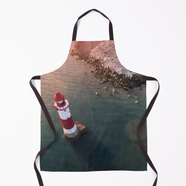 Item preview, Drone view of the red and white lighthouse by the rocky shoreline at Eastbourne. designed and sold by Revulet.