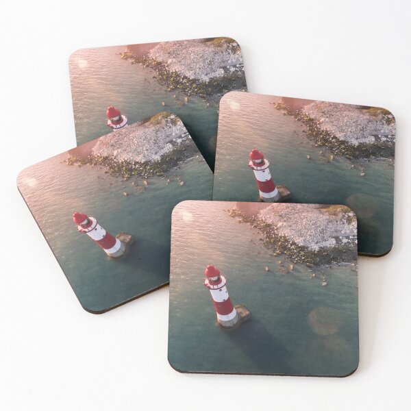 Item preview, Drone view of the red and white lighthouse by the rocky shoreline at Eastbourne. designed and sold by Revulet.