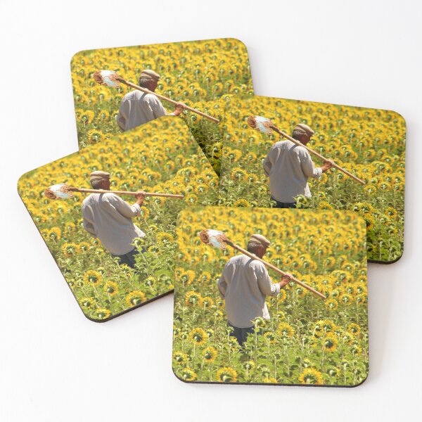 Item preview, Man walking through a vibrant sunflower field in summer designed and sold by Artessie.