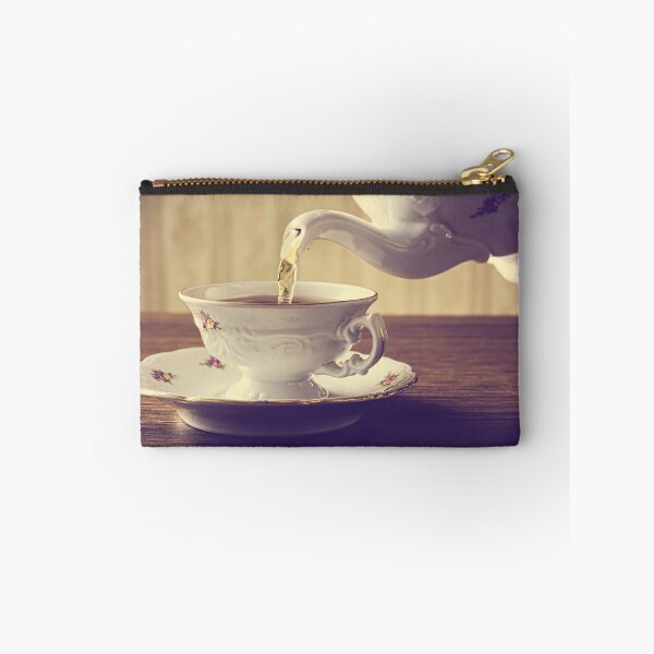 Item preview, A cup of tea being poured from an old-fashioned teapot at tea time designed and sold by Vetagio.