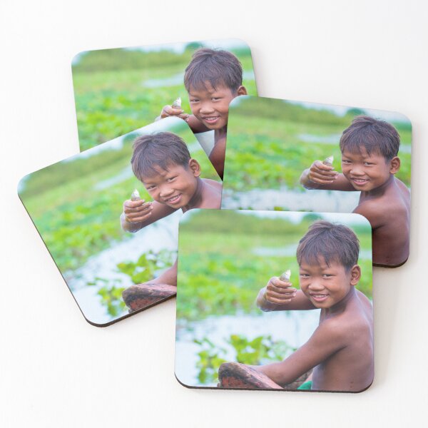 Item preview, Smiling boy holding fish on boat in lush green water area. designed and sold by Artessie.