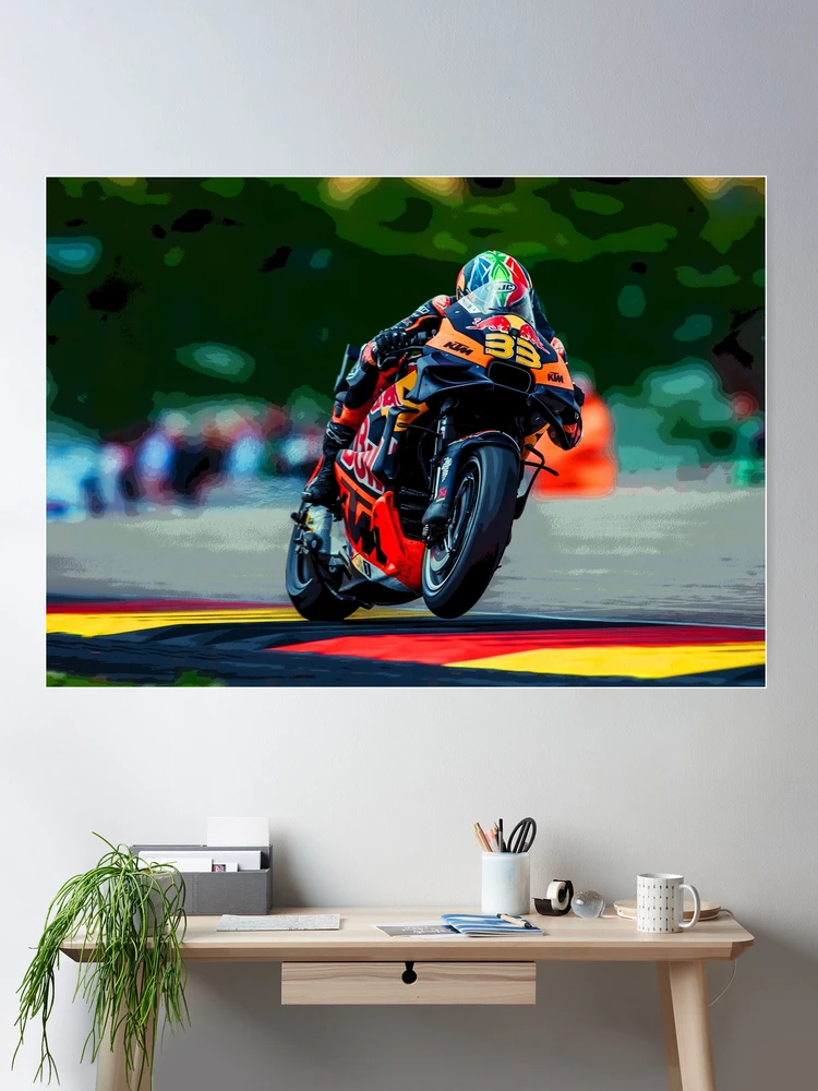Brad Binder hanging from his 2024 MotoGP motorcycle during the