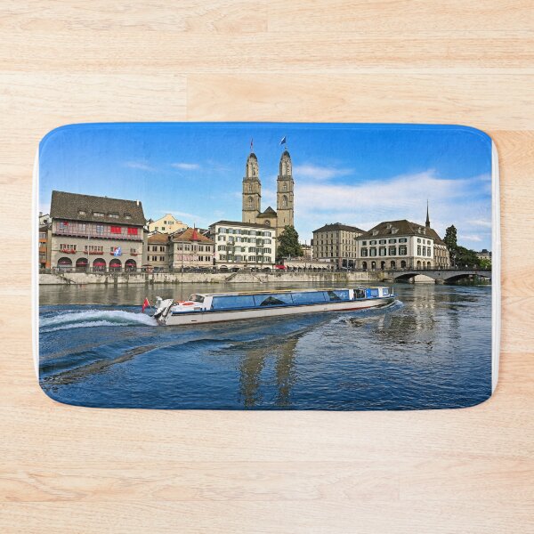 Item preview, Historic Zurich city center with famous Grossmunster churh and a tourist boat sails on the river Limmat, Switzerland designed and sold by goceris.