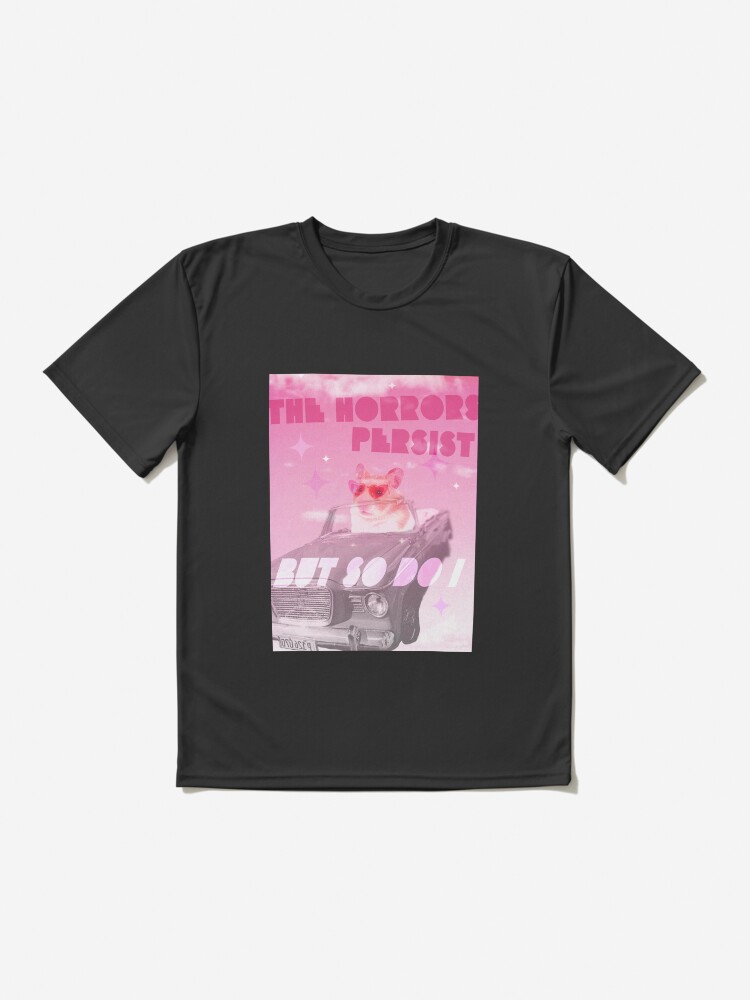 Imagen 2 de 7, Camiseta deportiva con la obra Los horrores persisten pero yo también meme hámster., diseñada y vendida por caitlinkdesigns.