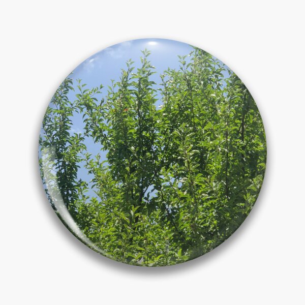 Item preview, Freshly blossomed apple branches next to mesmerising sky designed and sold by VillainSpot.