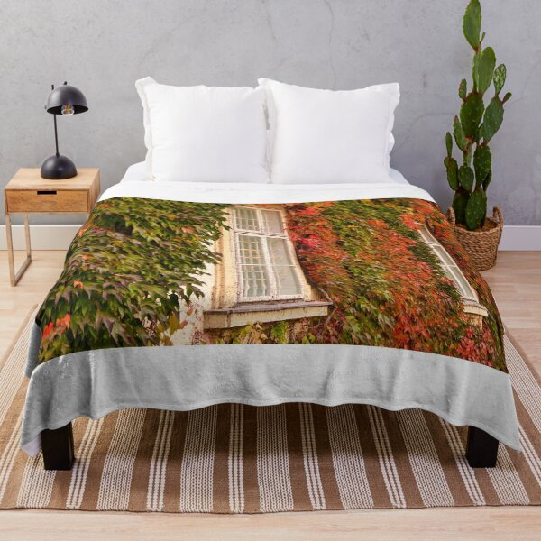 Item preview, Old house covered with colorful creeper leafs,autumn season designed and sold by goceris.