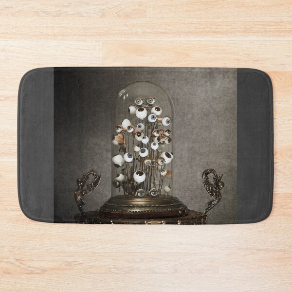Item preview, Antique blown glass doll eyes, inside a glass bell, on a metal table designed and sold by Cinzia Murgia.