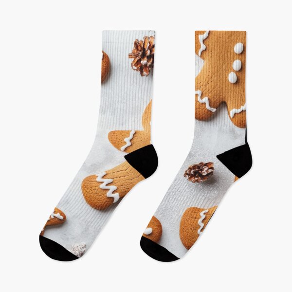 Item preview, Gingerbread cookies decorated with white icing and festive elements, arranged on a light background with pine cones and foliage. designed and sold by Jerhus.