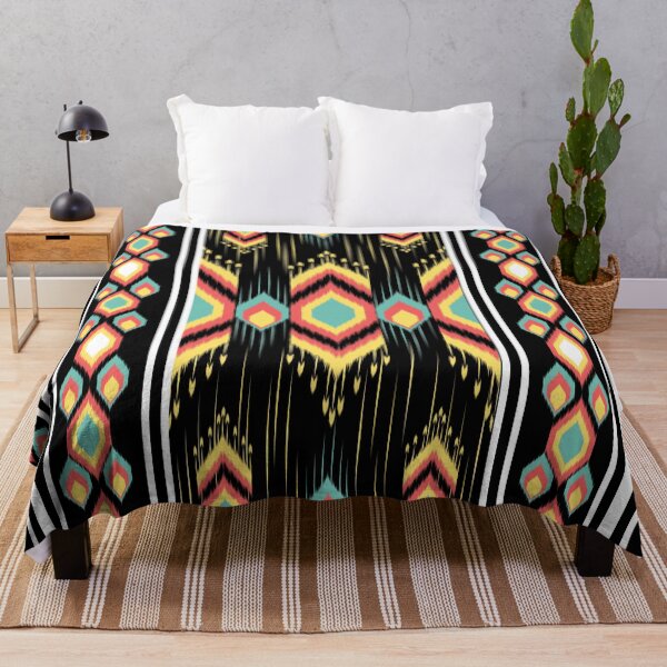 Item preview, A vibrant Ikat pattern featuring traditional tribal designs with bold colors on a black background designed and sold by Butsabakorn.