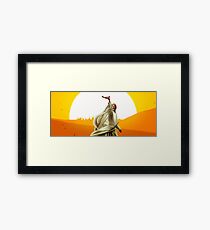 Lawrence of Arabia - Sunset on the desert with a man holding a gun Framed Print