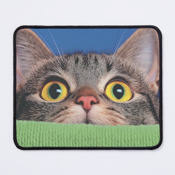 Item preview, Curious Cat with Wide Eyes: A playful tabby cat peeks over a green surface with wide, captivating eyes, radiating curiosity and mischief. designed and sold by tamtana.