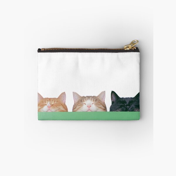 Item preview, A trio of adorable cats, each with a different coat, snooze peacefully with their heads peeking over a green surface designed and sold by tamtana.