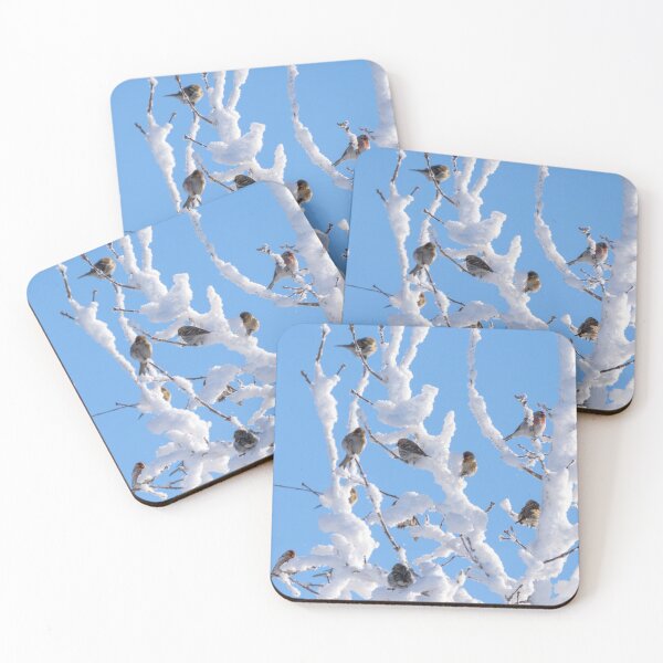 Item preview, A flock of birds landed on the branches of a tree covered with thick snow in close-up against the blue sky designed and sold by Klyakhin.