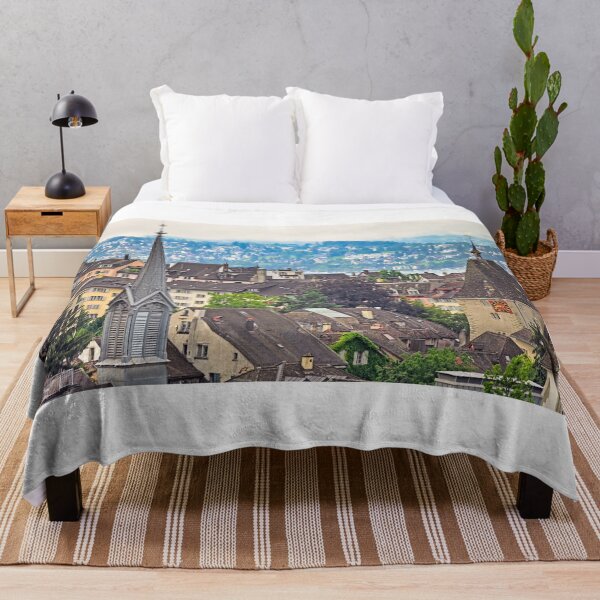 Item preview, Church clock towers and old houses in Zurich skyline, cloudy morning designed and sold by goceris.